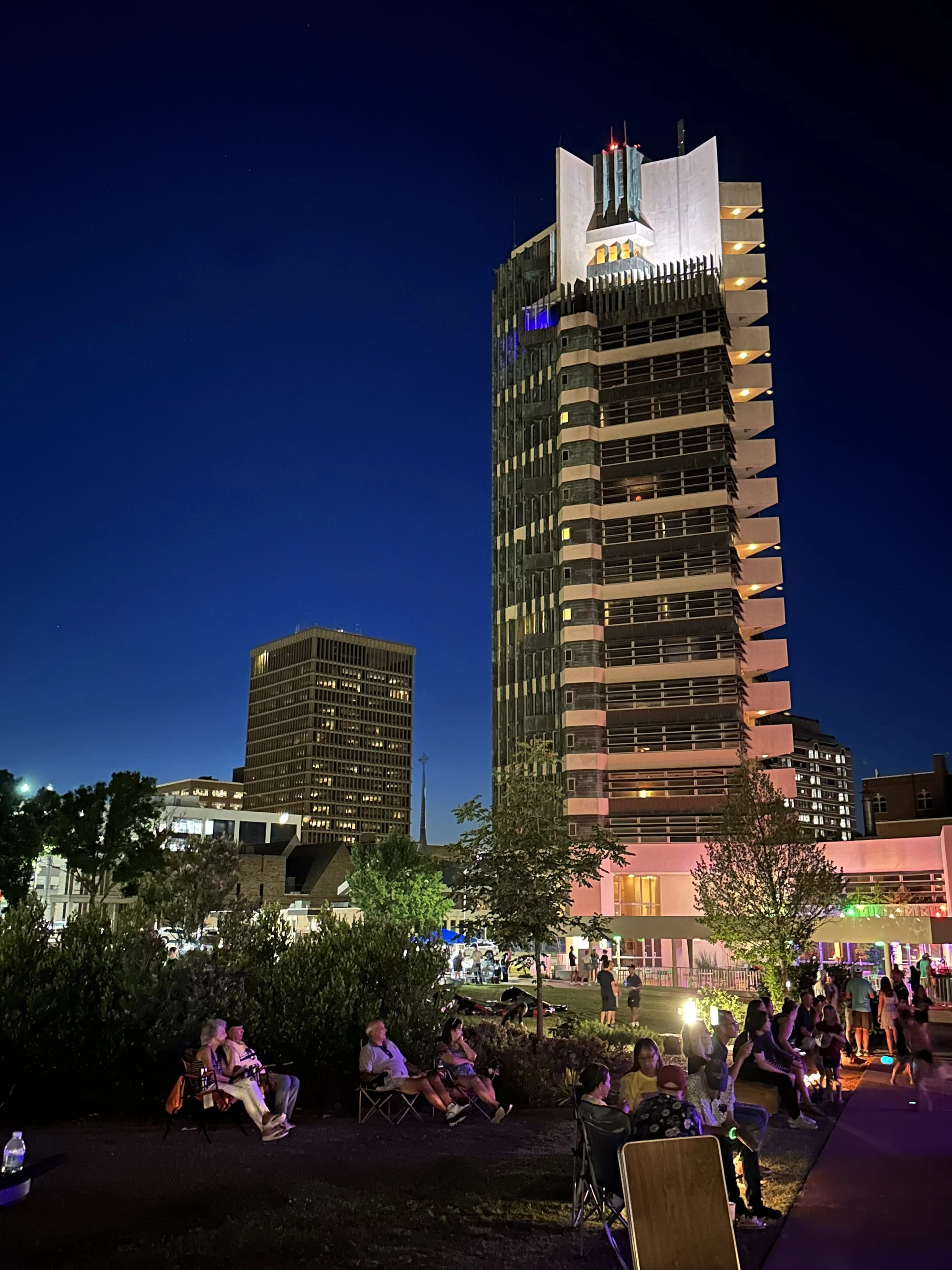 The Price Tower in downtown Bartlesville, Oklahoma, lit at night during a community gathering